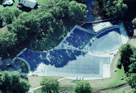 Commercial pool cover protecting a large facility pool